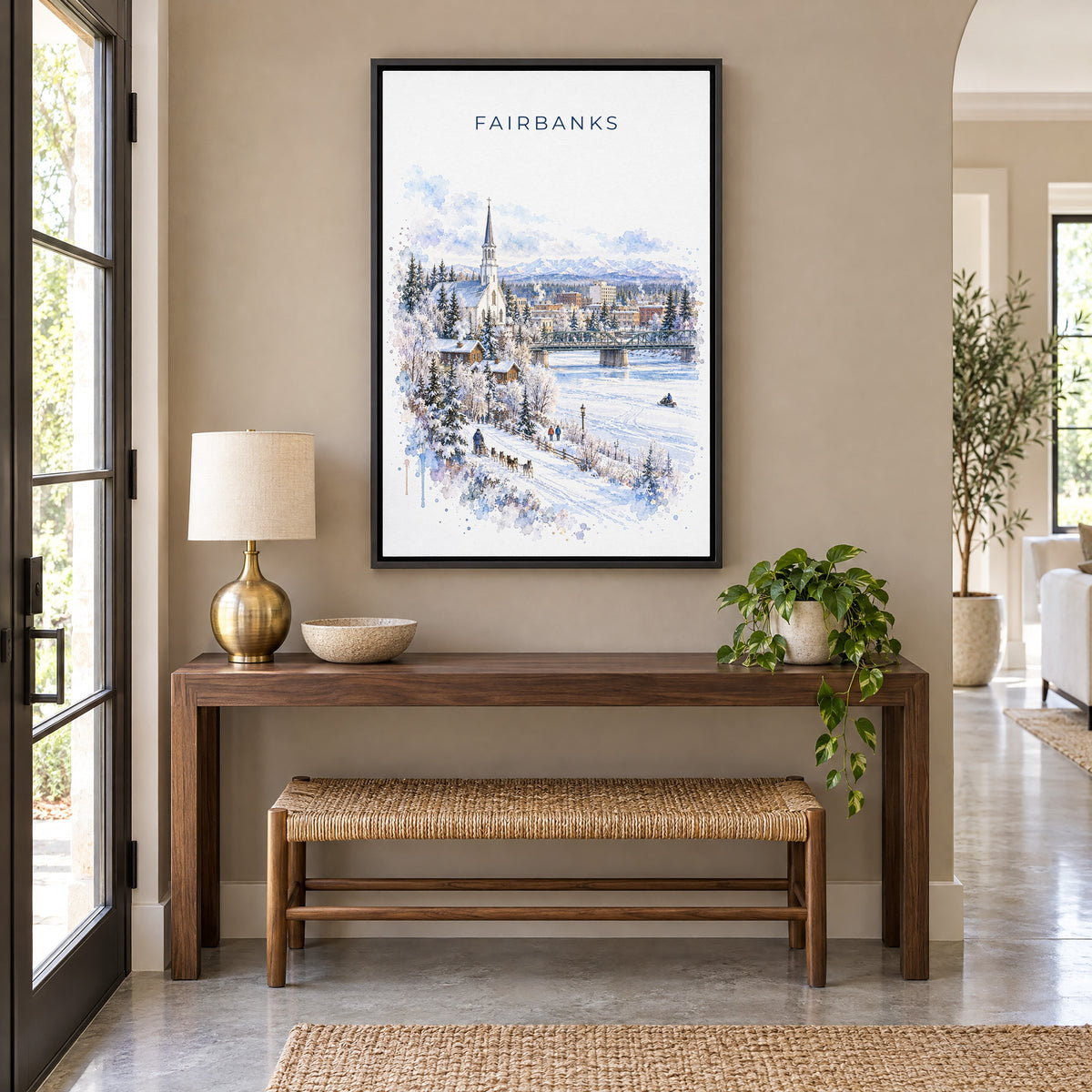 Fairbanks watercolor print as a black floater canvas above a walnut console and woven bench in an entryway