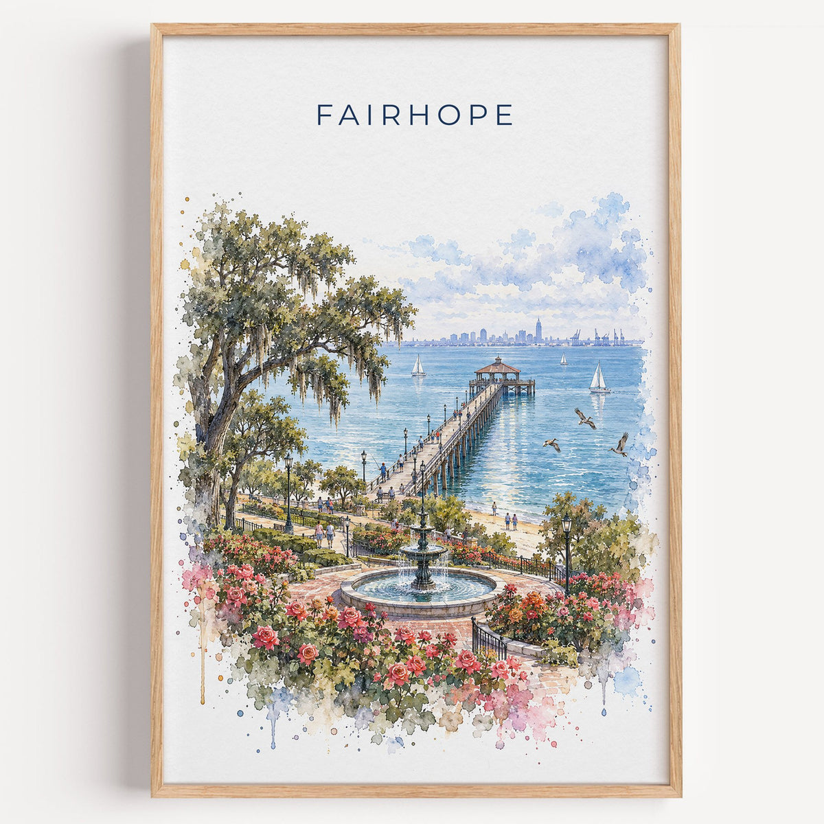 Fairhope watercolor print in a light oak frame on a plain white wall