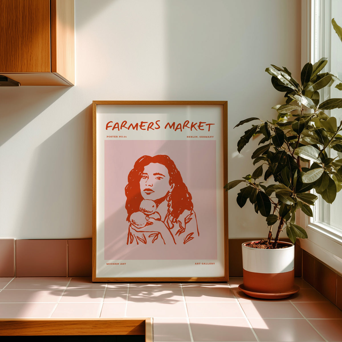 Farmers Market curly hair print in an oak frame on pink tiles in the sun
