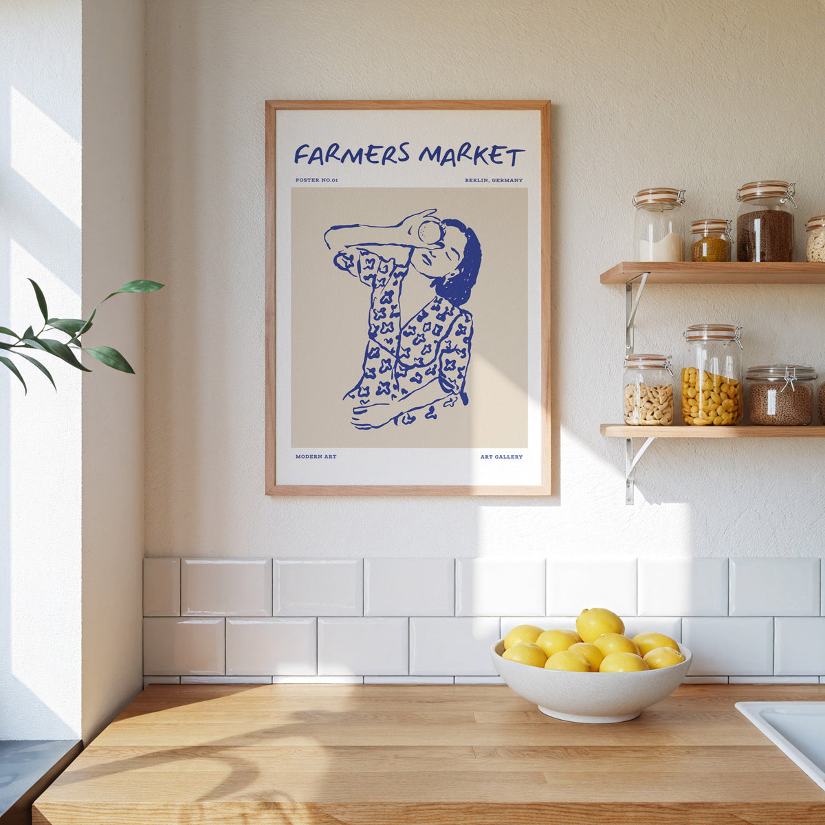 Farmers Market portrait print in an oak frame beside open kitchen shelves