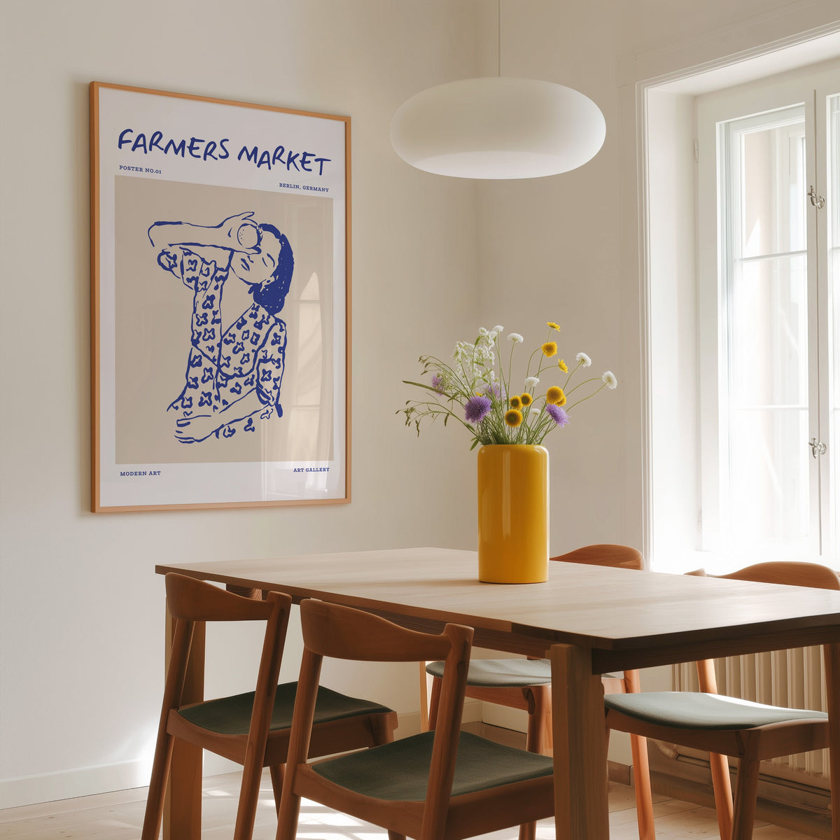 Farmers Market portrait print in a slim oak frame above a dining table