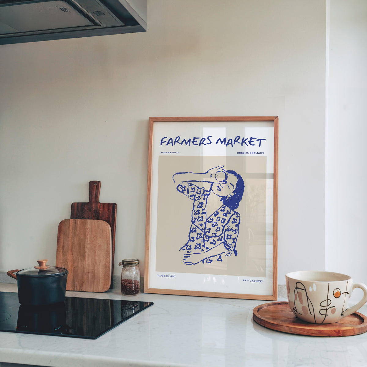 Farmers Market portrait print in a pine frame on a marble kitchen counter