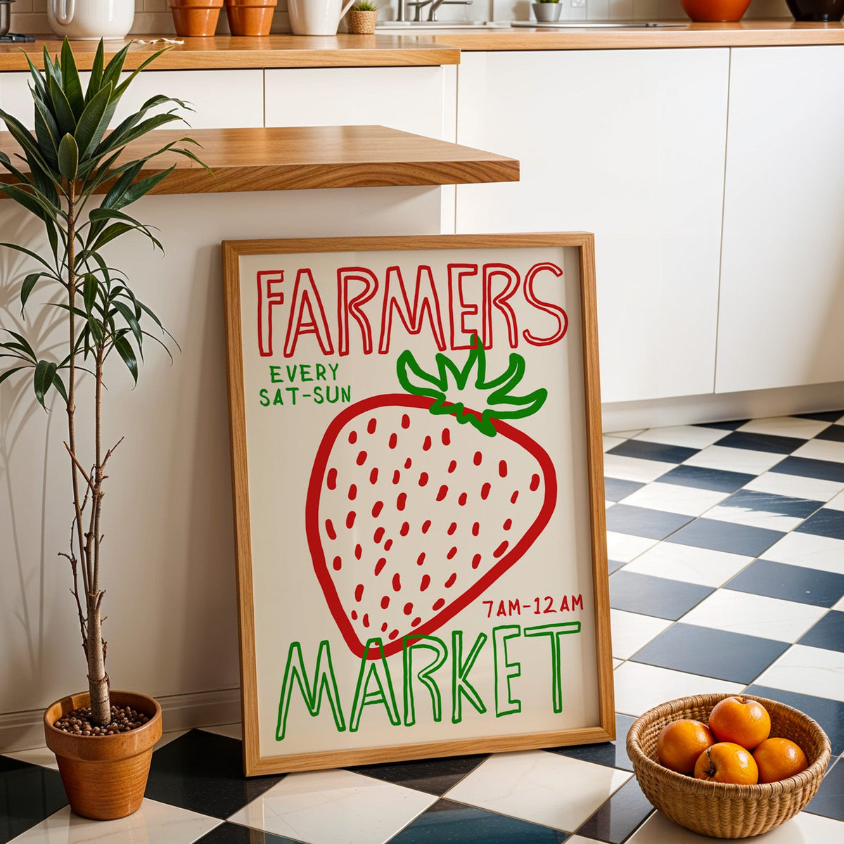 Farmers market strawberry print in an oak frame by a kitchen island and checkered floor