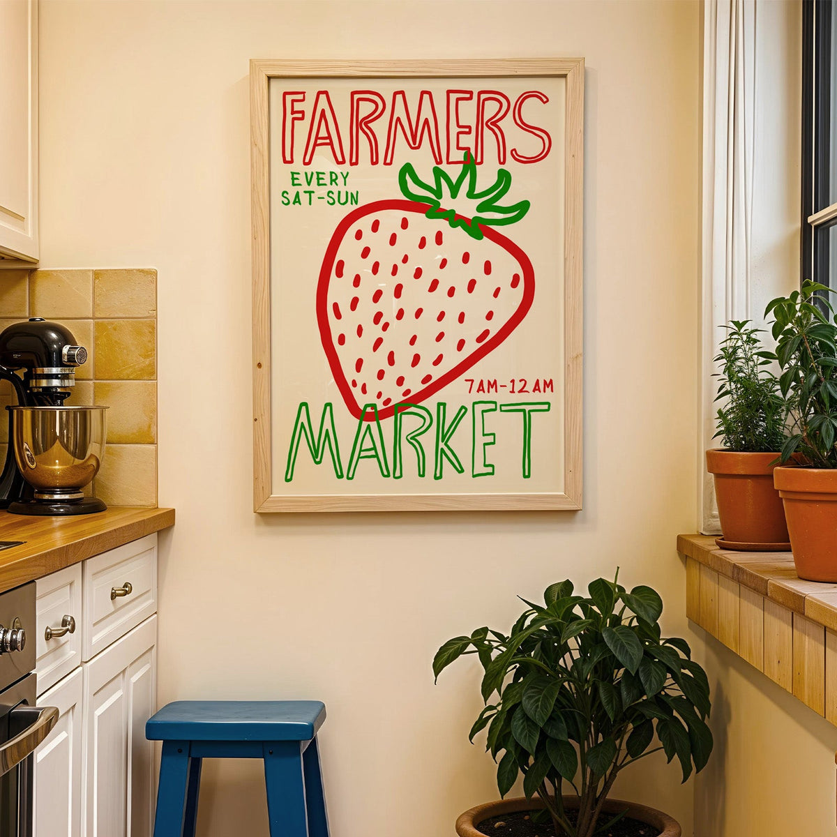 Farmers market strawberry print in a wood frame on a yellow tiled kitchen wall