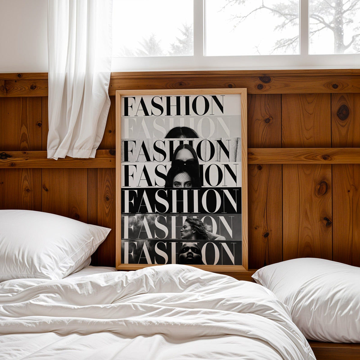 Seven stacked FASHION cover strips print in a pine frame leaning on a wood headboard over white bedding