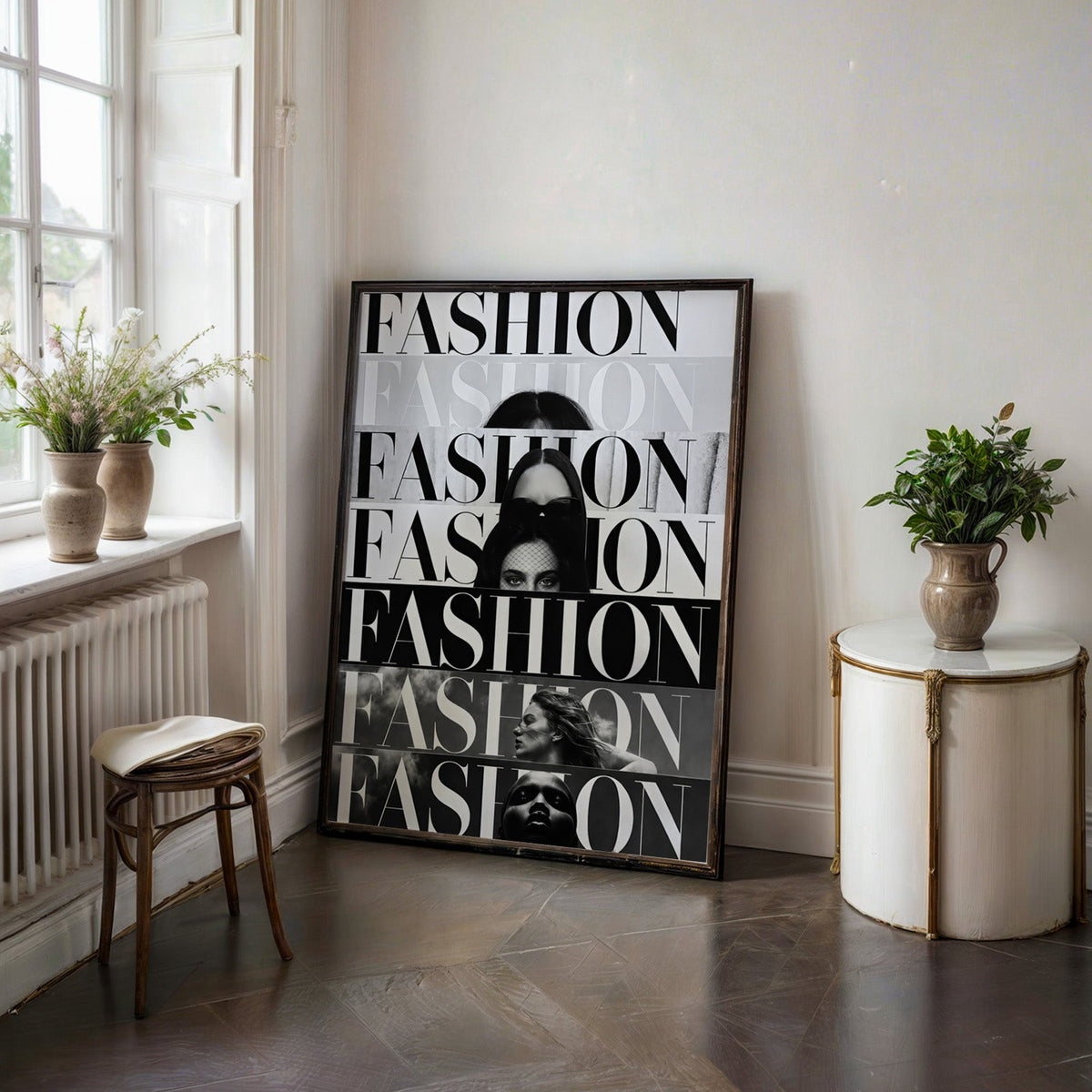 Seven stacked FASHION cover strips print in a black frame on a dark stone floor beside a white side table