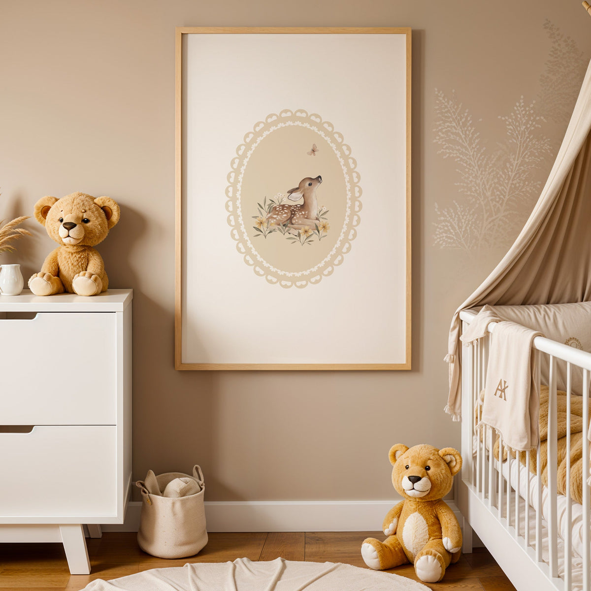 Fawn watching a butterfly in a lace oval nursery print in an oak frame between a white dresser and a canopy crib