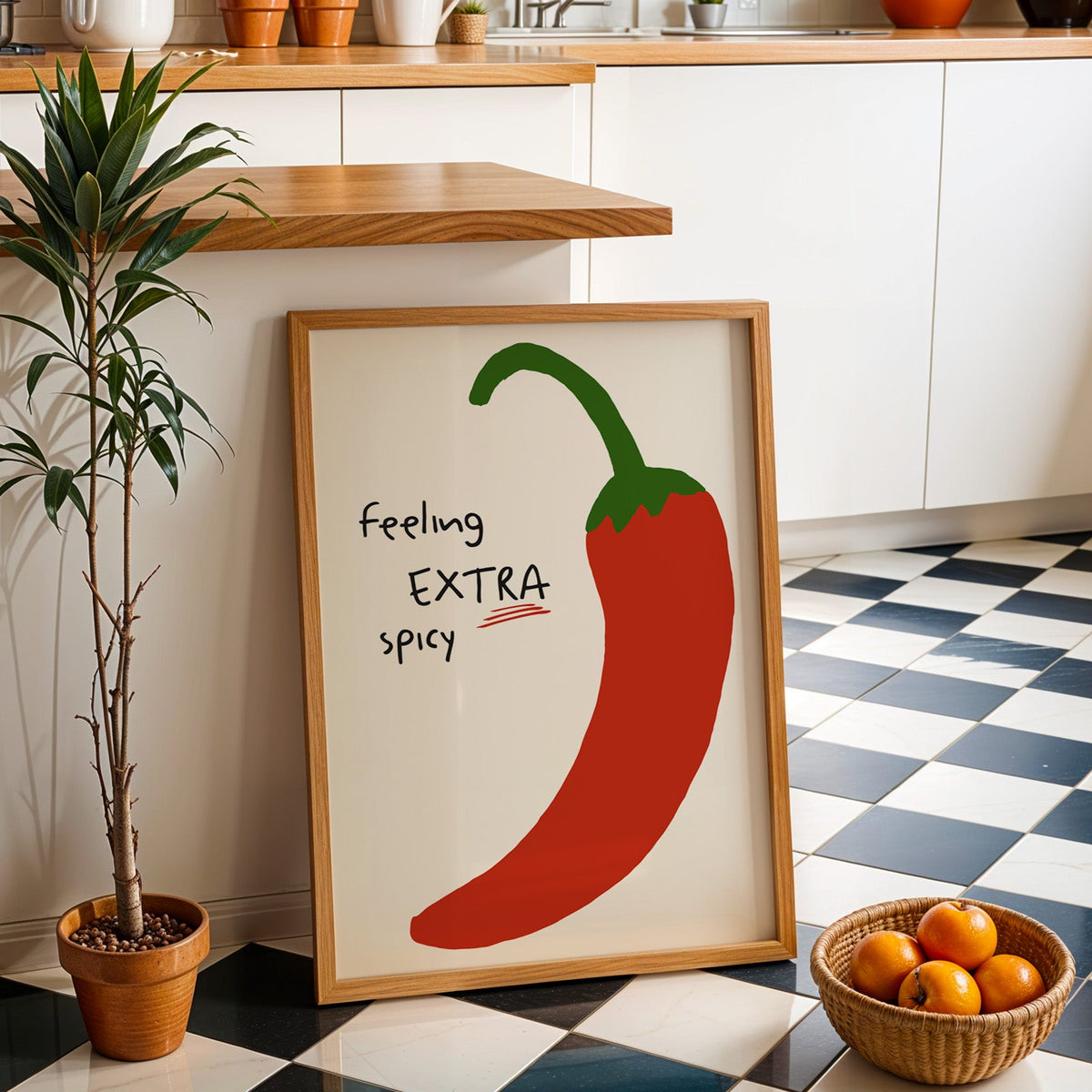 Feeling extra spicy chili print in an oak frame by a kitchen island and checkered floor