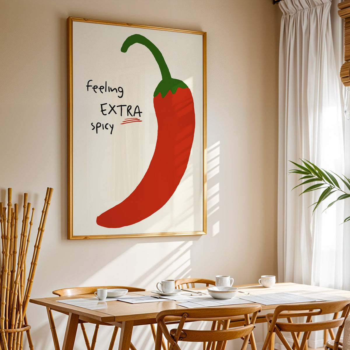 Feeling extra spicy chili print in a gold frame above a sunlit breakfast table