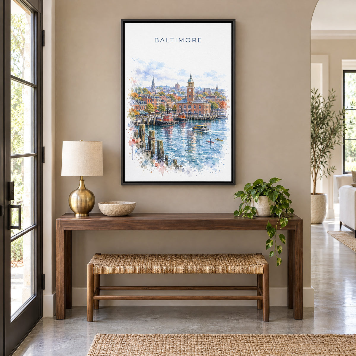 Fells Point Baltimore watercolor print as a black floater canvas above a walnut console and woven bench in an entryway