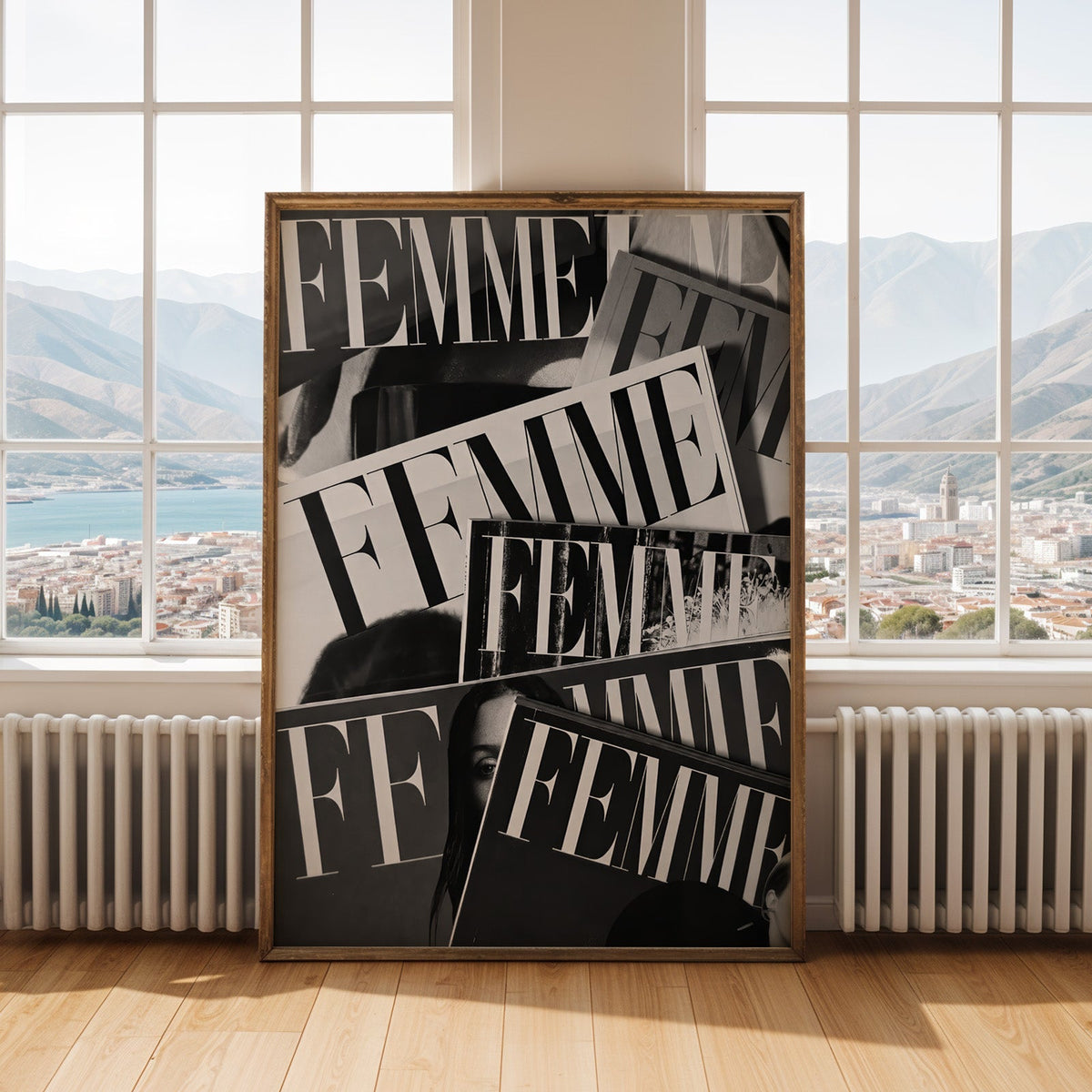 Layered FEMME magazine covers collage print shown in an antique gold frame by tall windows with a sea view