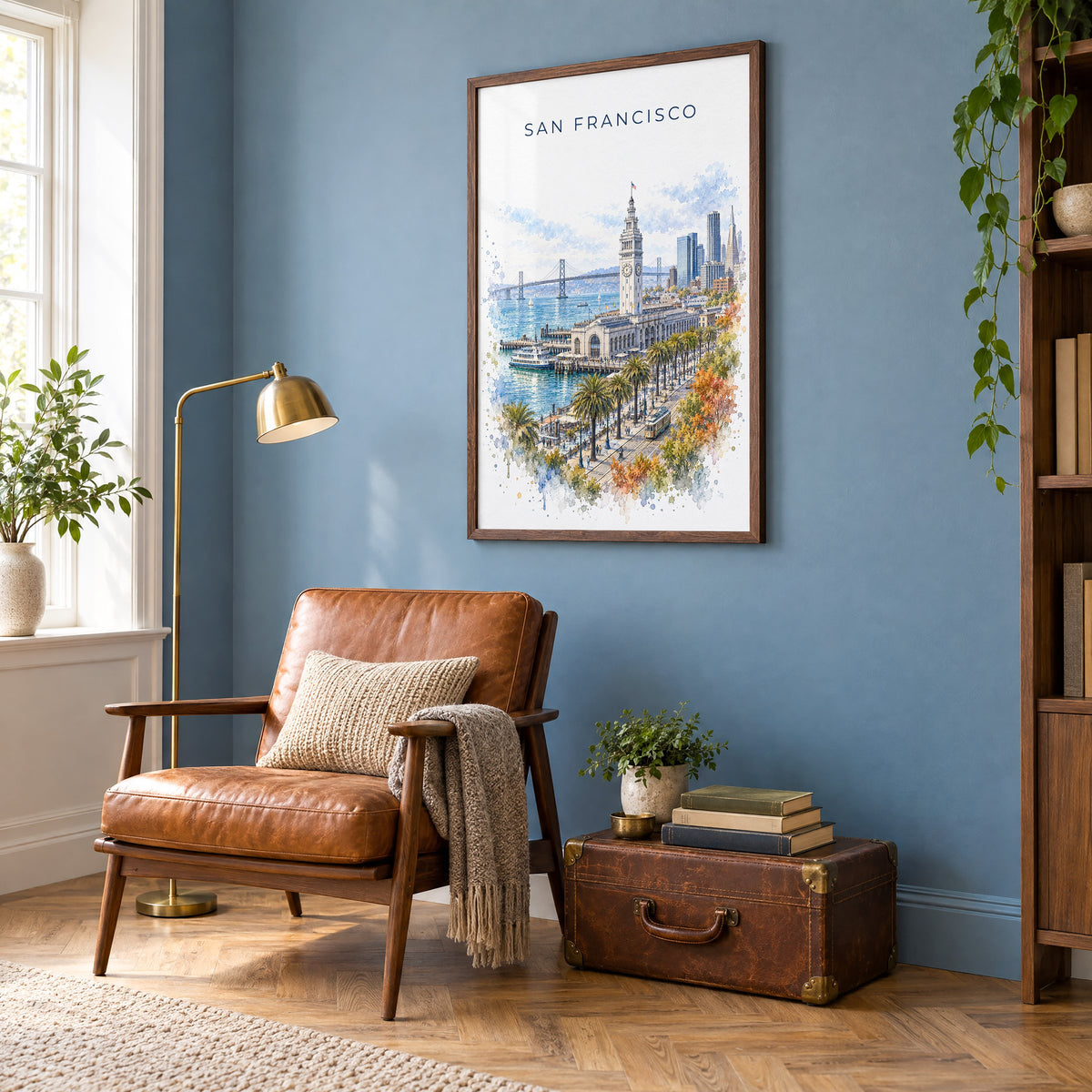 Ferry Building San Francisco watercolor print in a walnut frame on a blue wall above a leather armchair in a reading nook