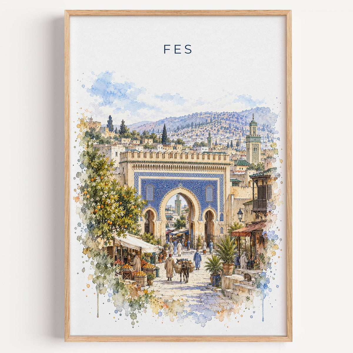 Fes, Morocco watercolor print in a light oak frame on a plain white wall