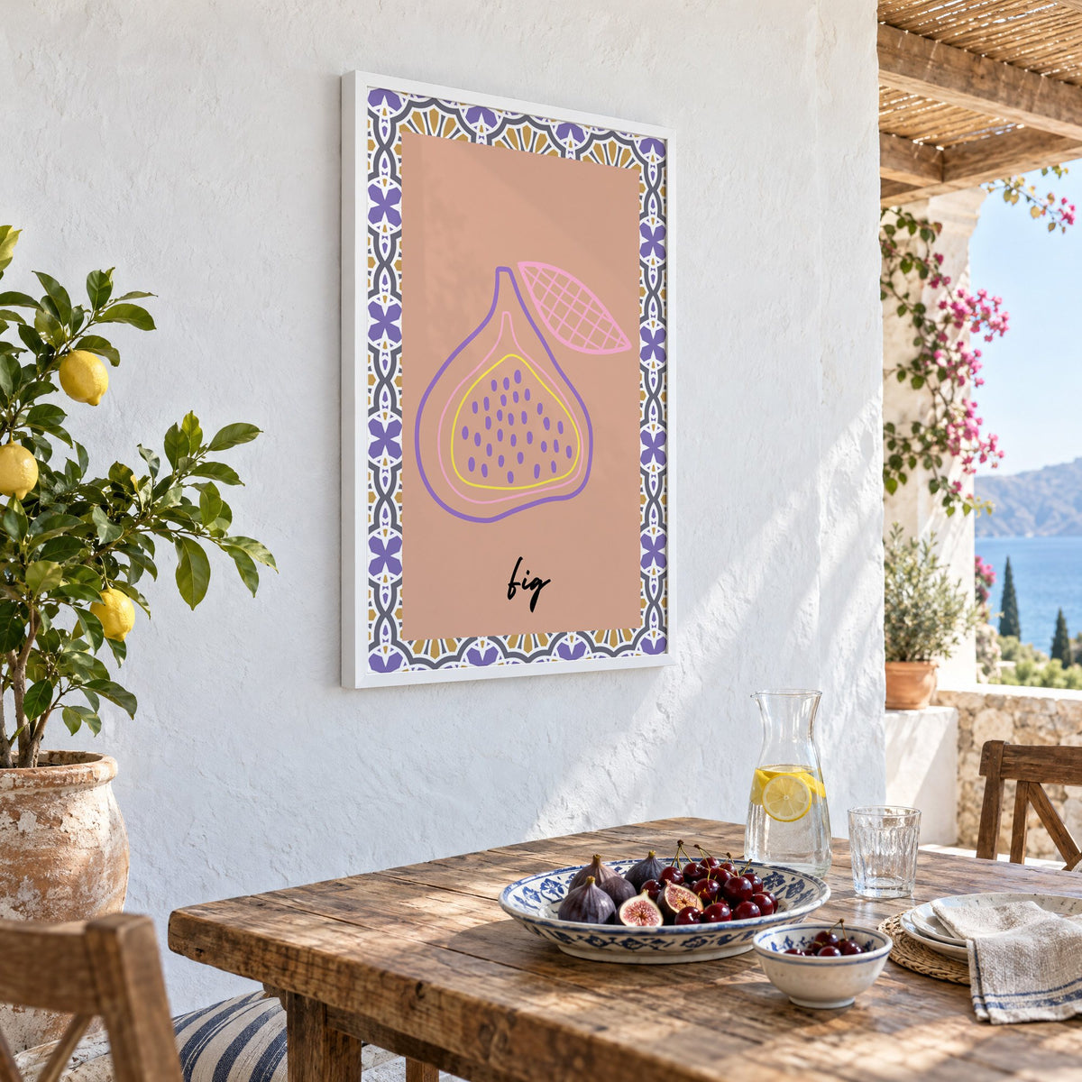 fig pastel outline purple tile print in a white frame on a whitewashed terrace wall above a lunch table with figs and cherries, seen at an angle