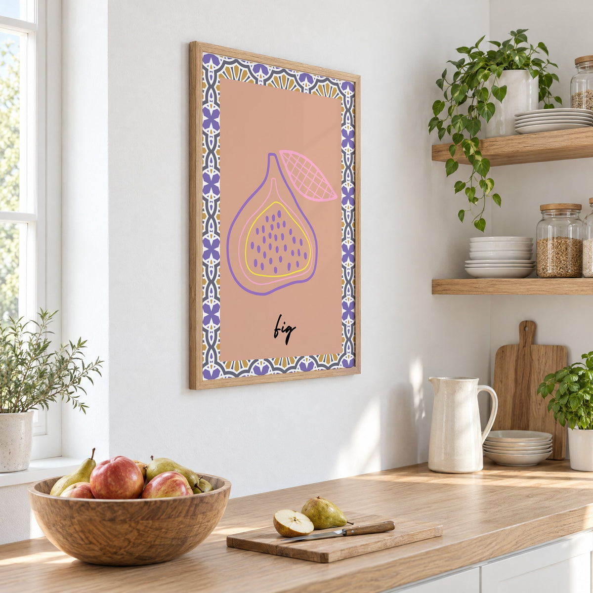 fig pastel outline purple tile print in an oak frame on a white kitchen wall above a counter with apples and pears, seen at an angle