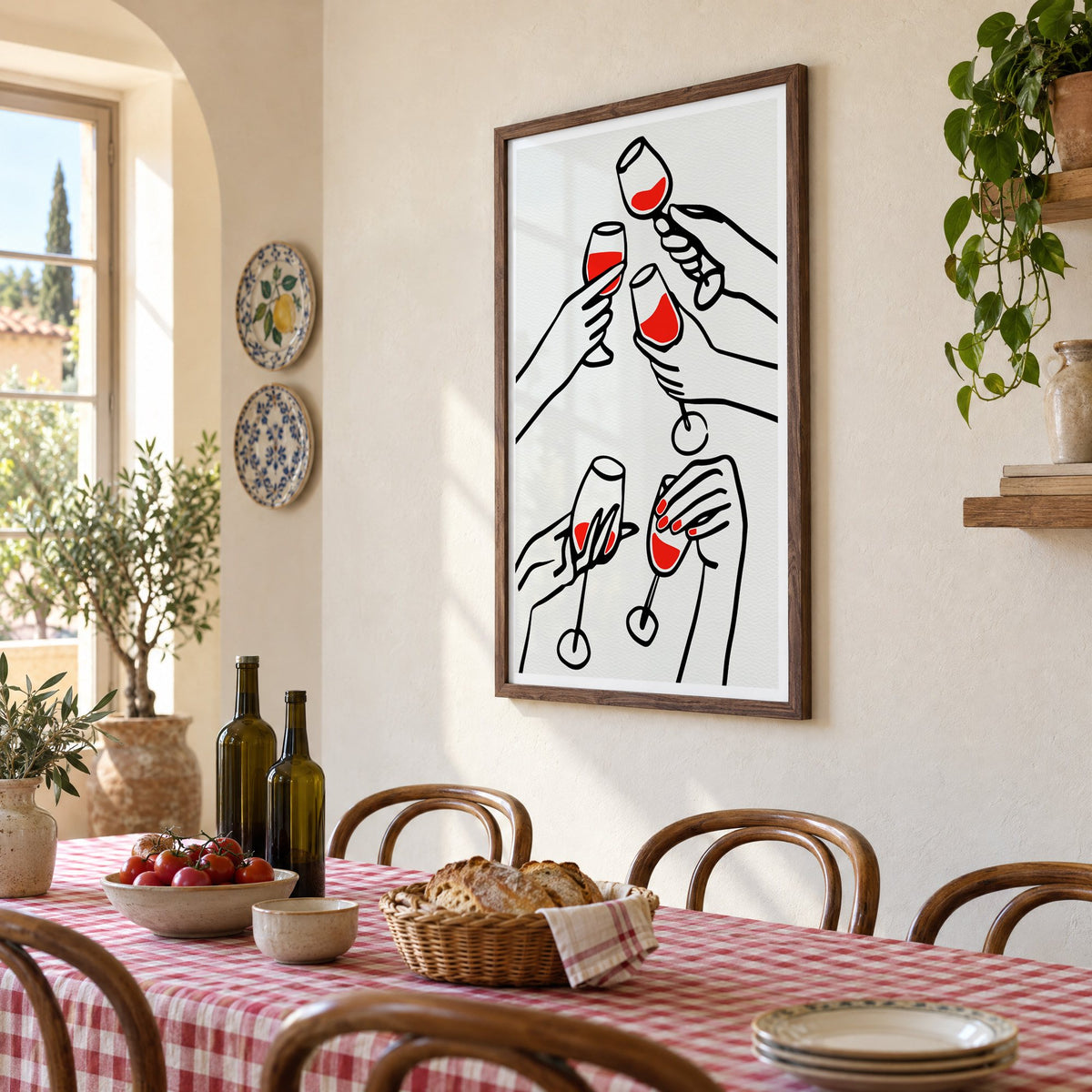 Five hands red wine toast line print in a walnut frame above a gingham-covered trattoria table, seen at an angle