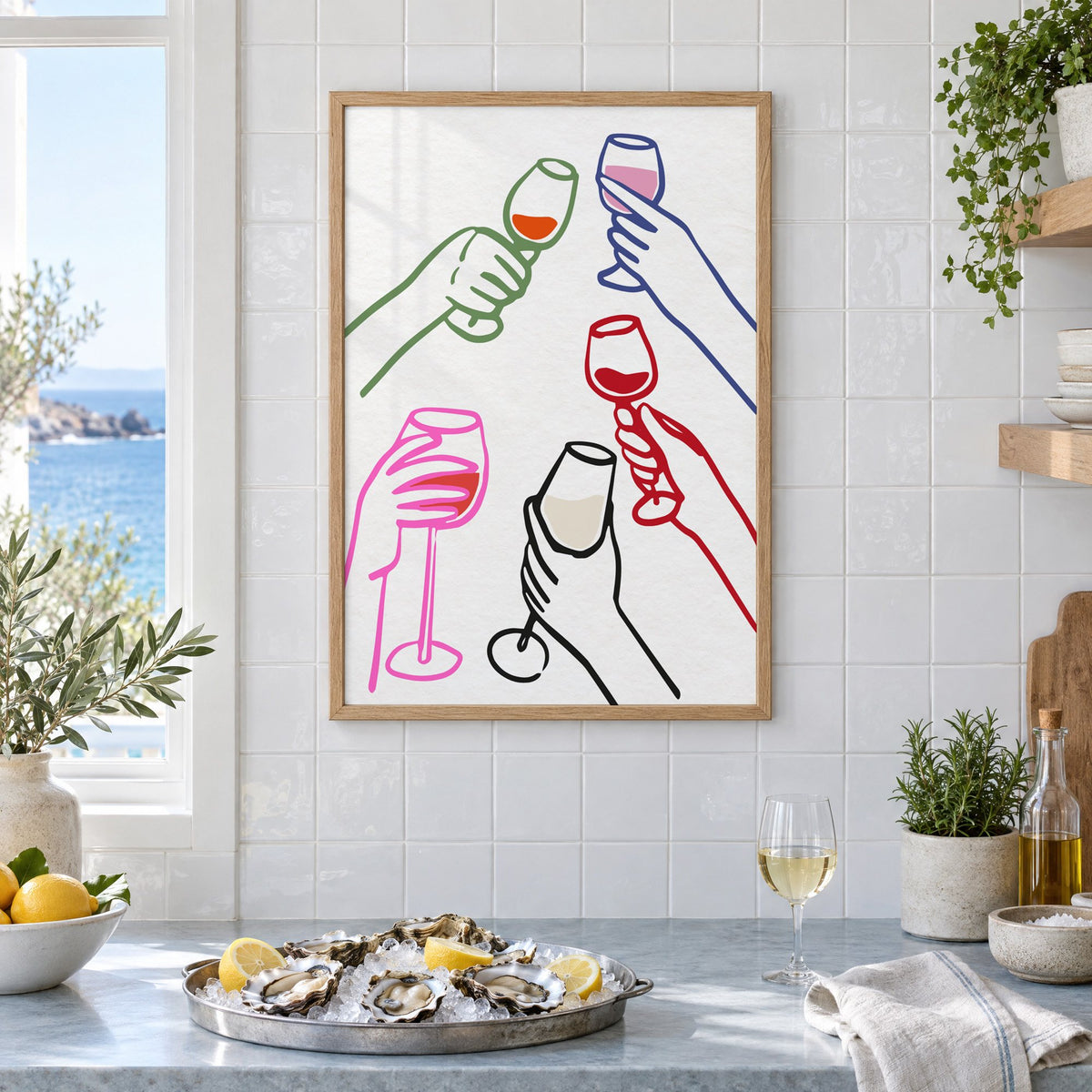 Five hands multicolor wine toast print in an oak frame on white tiles above a marble counter with oysters and lemons by a sea view
