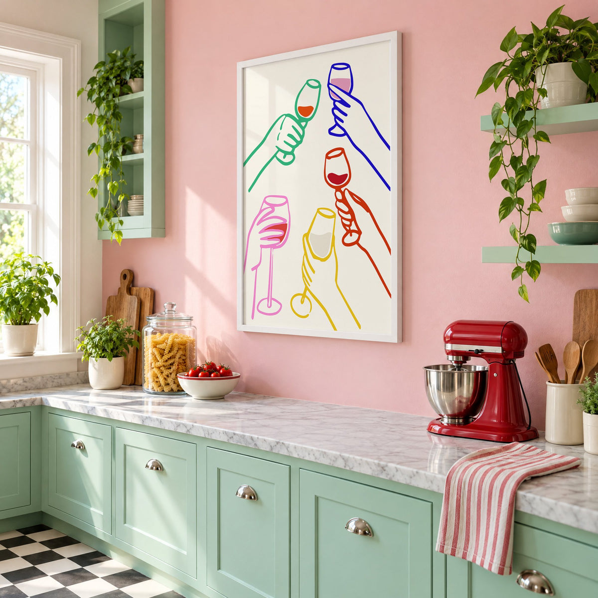 Five hands colorful line wine toast print in a white frame on a pink wall above mint green cabinets in a retro kitchen, seen at an angle