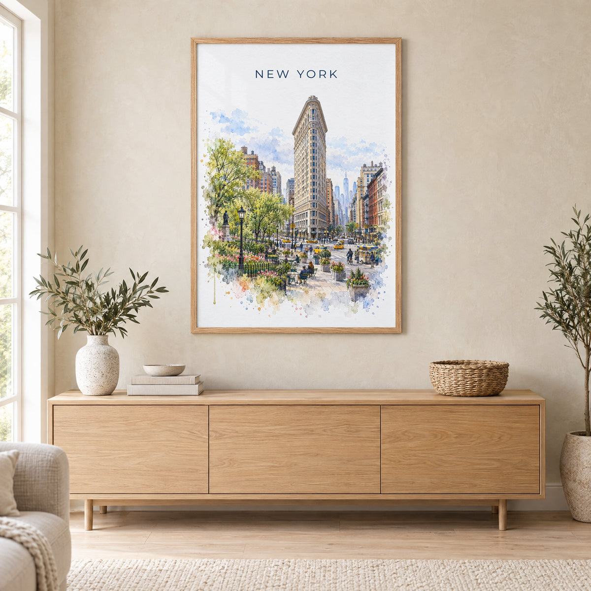 Flatiron Building watercolor print in an oak frame above a light wood sideboard in a Scandinavian living room