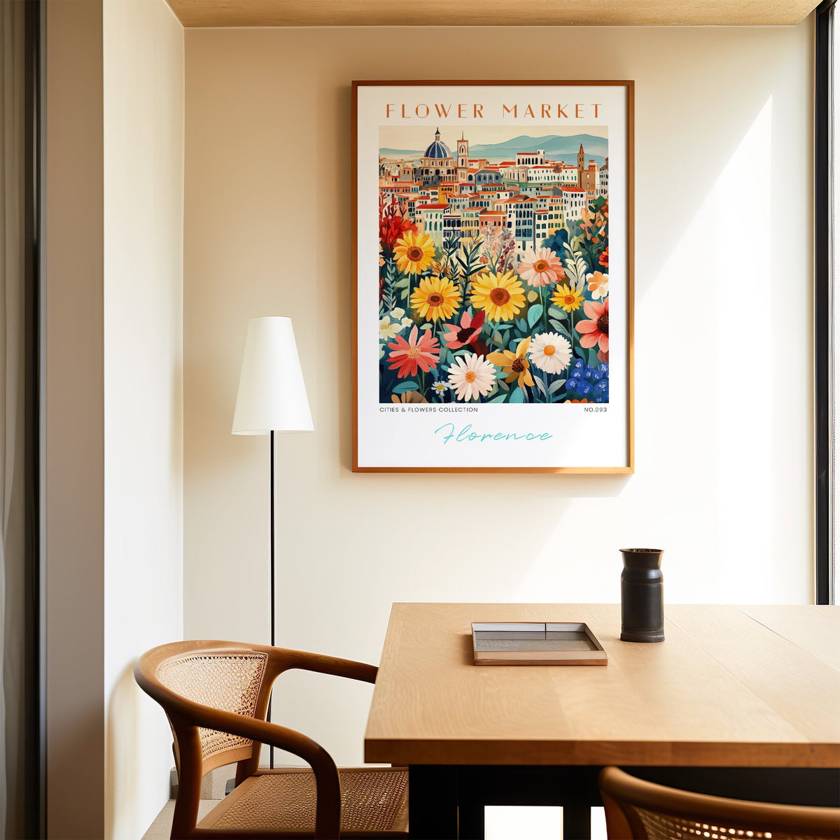 Florence flower market print in an oak frame above a dining table and cane chair