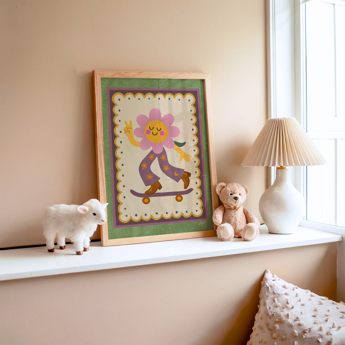 Groovy flower on skateboard nursery print in an oak frame on a window ledge with a toy lamb and teddy