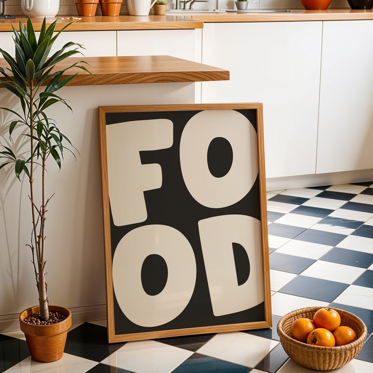 Bold food typography print in an oak frame by a kitchen island and checkered floor