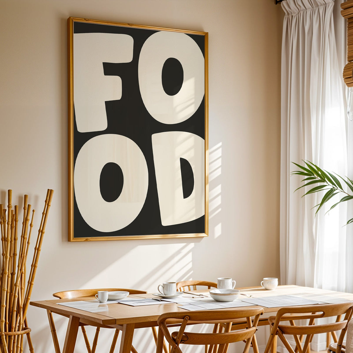 Bold food typography print in a gold frame above a sunlit breakfast table