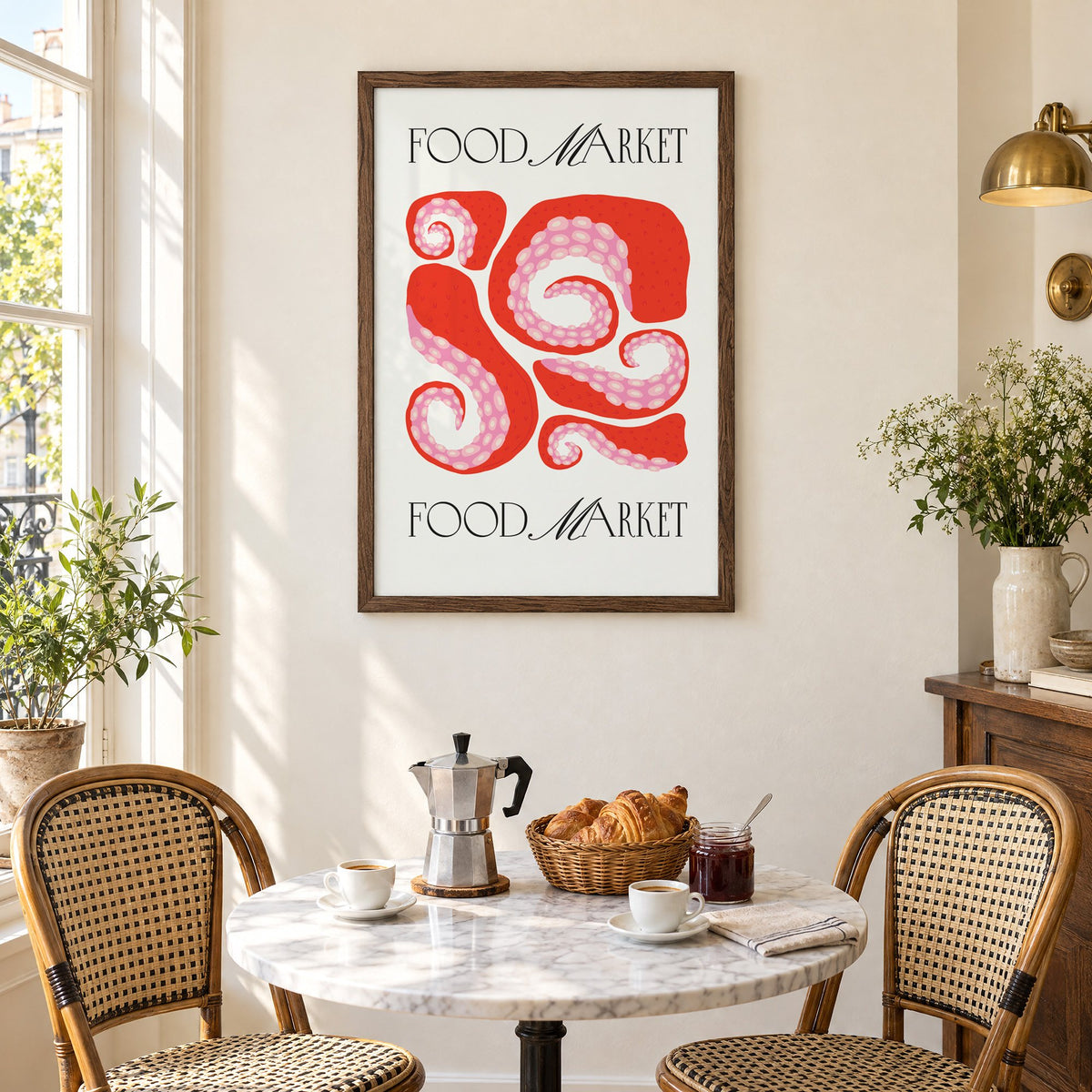 FOOD MARKET red octopus tentacles print in a walnut frame above a marble bistro table with croissants and rattan chairs