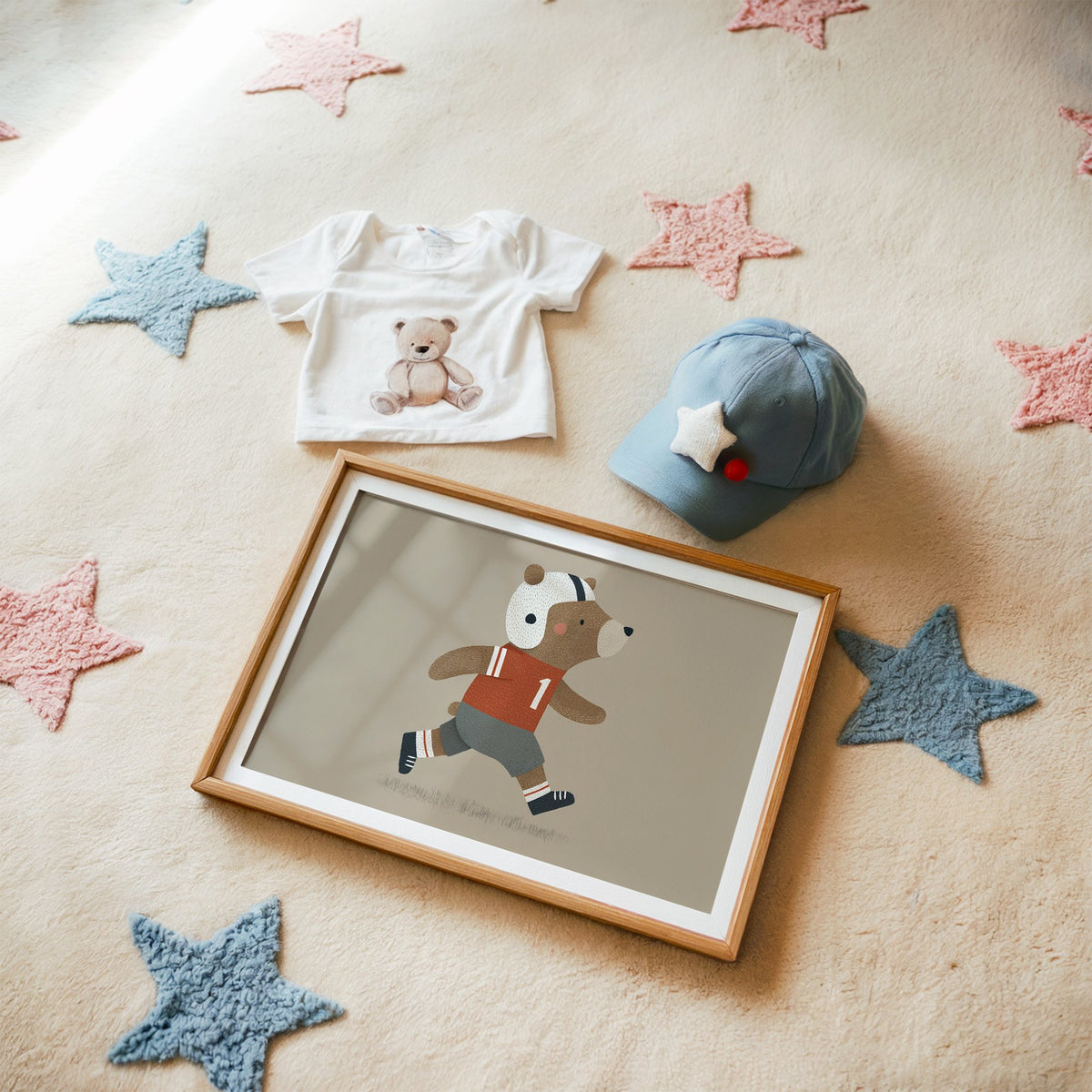 Landscape football bear number one nursery print in a matted oak frame on a star rug with a baby tee