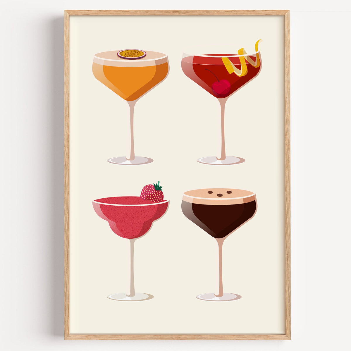 Four coupe cocktails two-by-two grid print in a light oak frame on a plain white wall