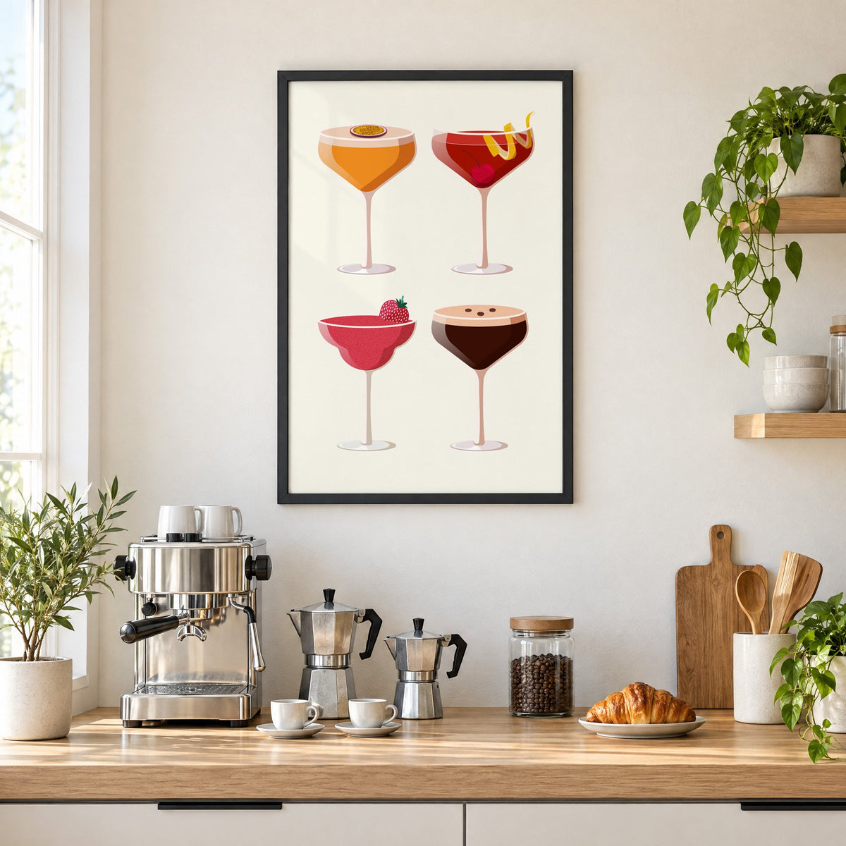 Four coupe cocktails two-by-two grid print in a black frame above a home espresso bar with moka pots and espresso cups