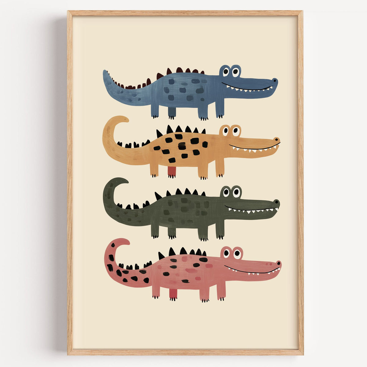 Four stacked crocodiles nursery print in a light oak frame on a plain white wall
