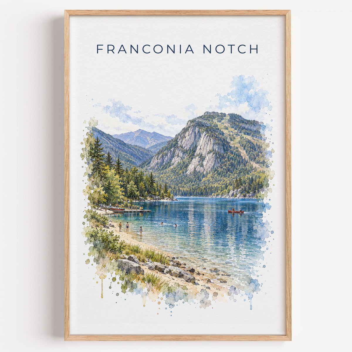 Franconia Notch watercolor print in a light oak frame on a plain white wall