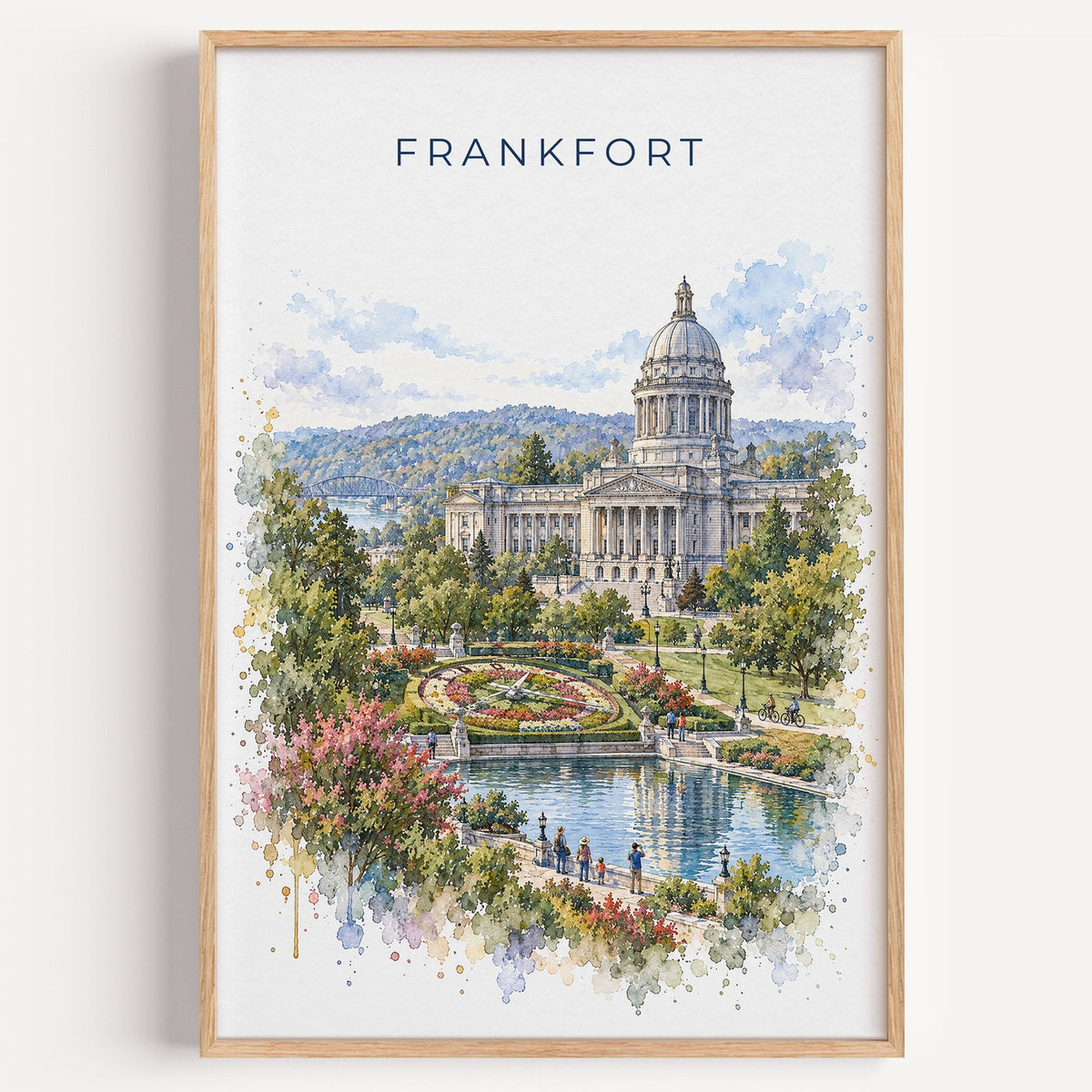 Frankfort, Kentucky watercolor print in a light oak frame on a plain white wall