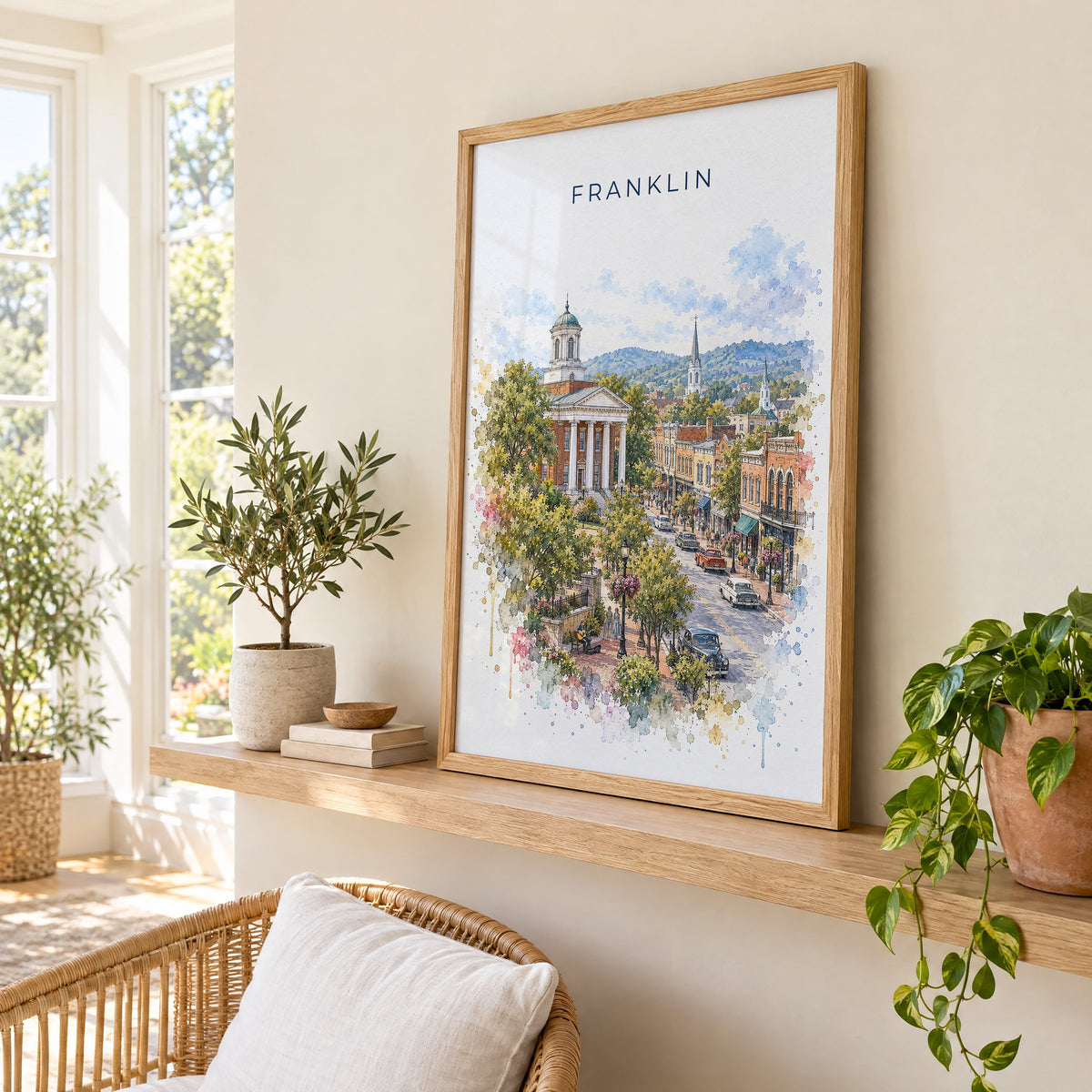 Franklin, Tennessee watercolor print in an oak frame on a picture ledge in a sunlit sunroom