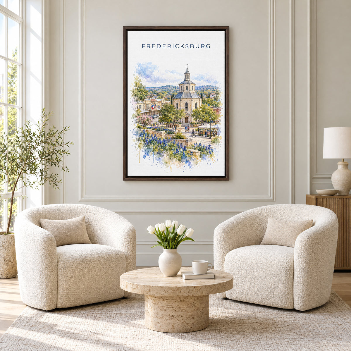 Fredericksburg, Texas watercolor print as an espresso floater canvas above two boucle armchairs in a hotel lounge