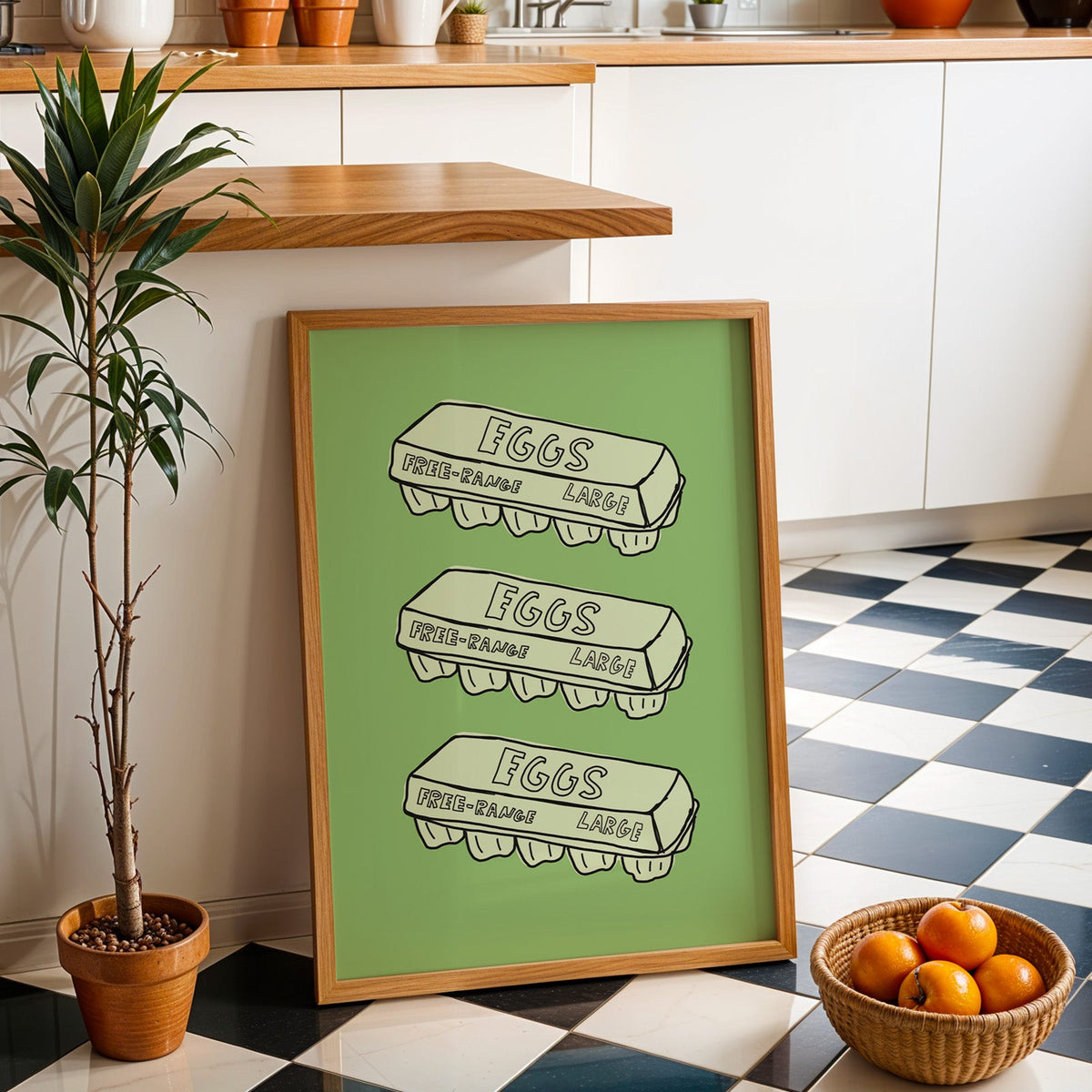 Free range eggs carton print in an oak frame by a kitchen island and checkered floor