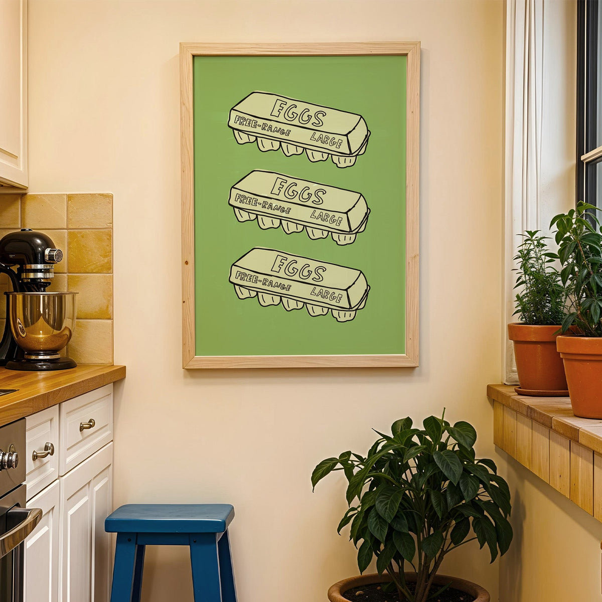 Free range eggs carton print in a wood frame on a yellow tiled kitchen wall