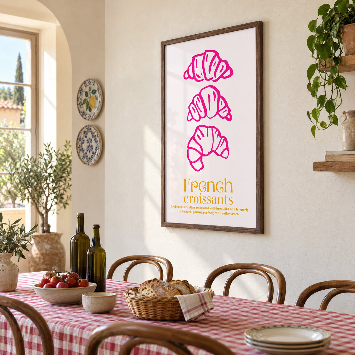 French croissants hot pink line print in a walnut frame above a gingham-covered trattoria table, seen at an angle