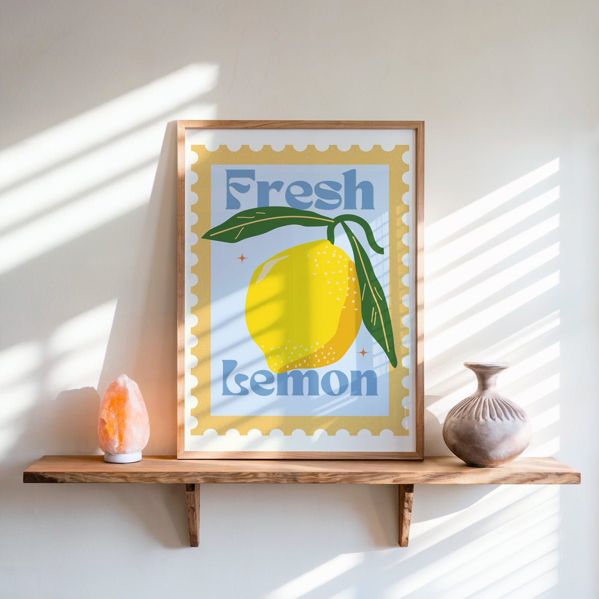 Fresh Lemon stamp print in an oak frame on a live-edge shelf beside a salt lamp