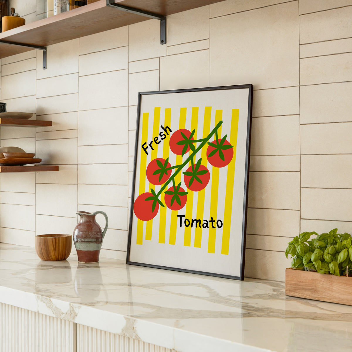 Fresh Tomato print in a black frame leaning on a marble counter in a tiled kitchen