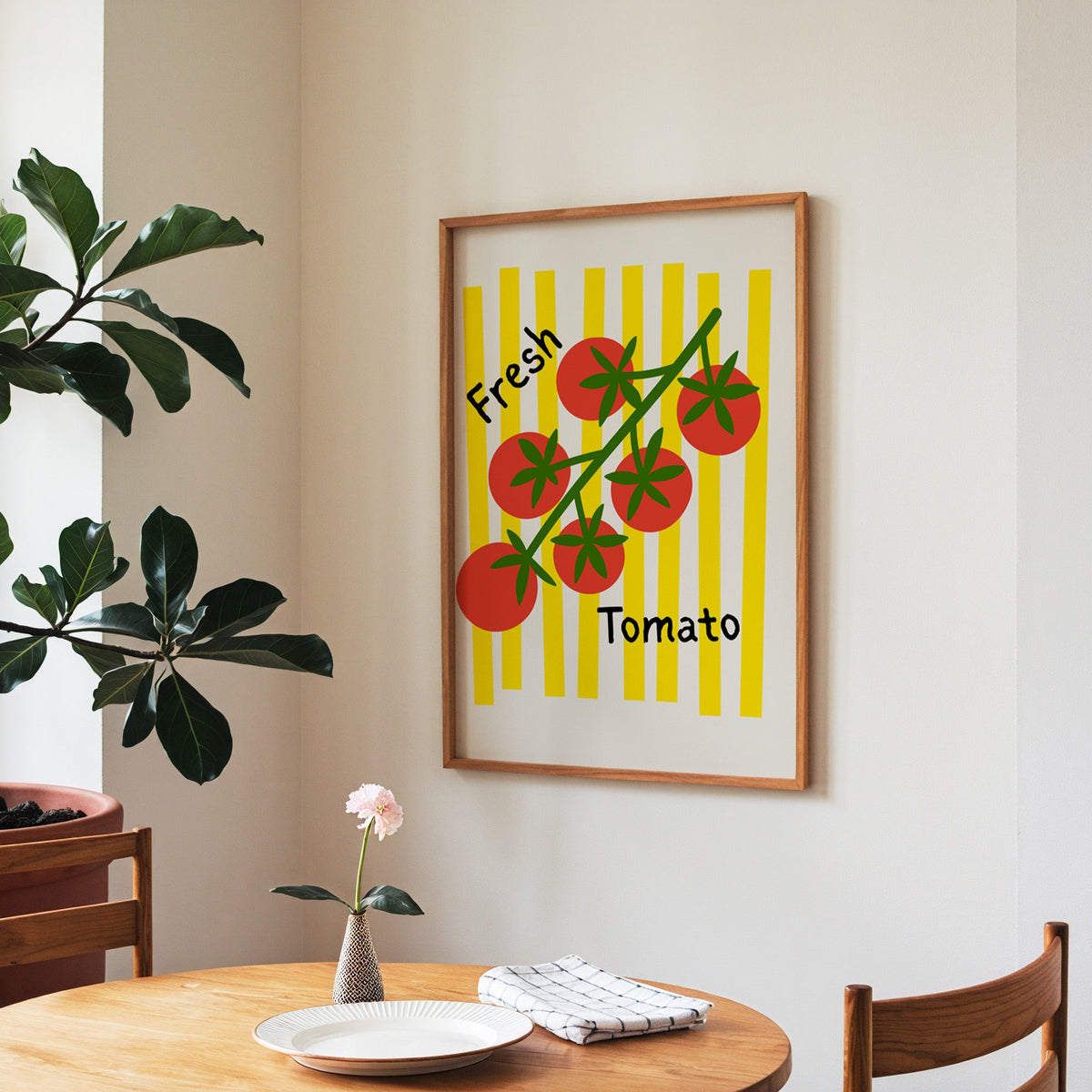 Fresh Tomato print in a walnut frame above a round table beside a fiddle-leaf fig