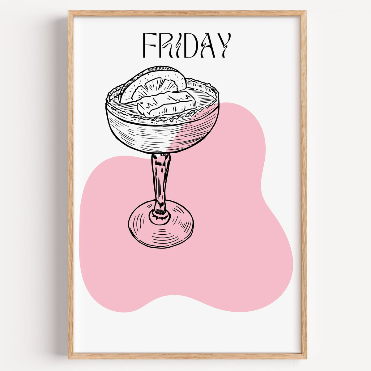 FRIDAY engraved coupe cocktail pink blob print in a light oak frame on a plain white wall