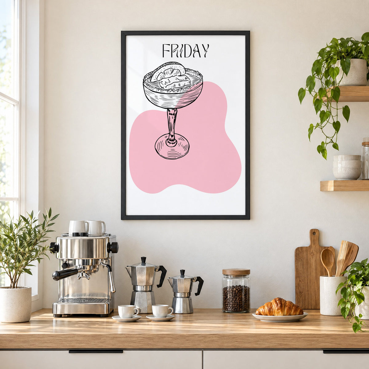 FRIDAY engraved coupe cocktail pink blob print in a black frame above a home espresso bar with moka pots and espresso cups