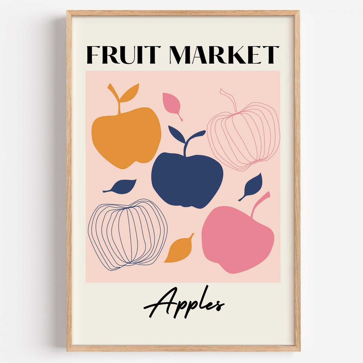 FRUIT MARKET Apples cut-paper print in a light oak frame on a plain white wall