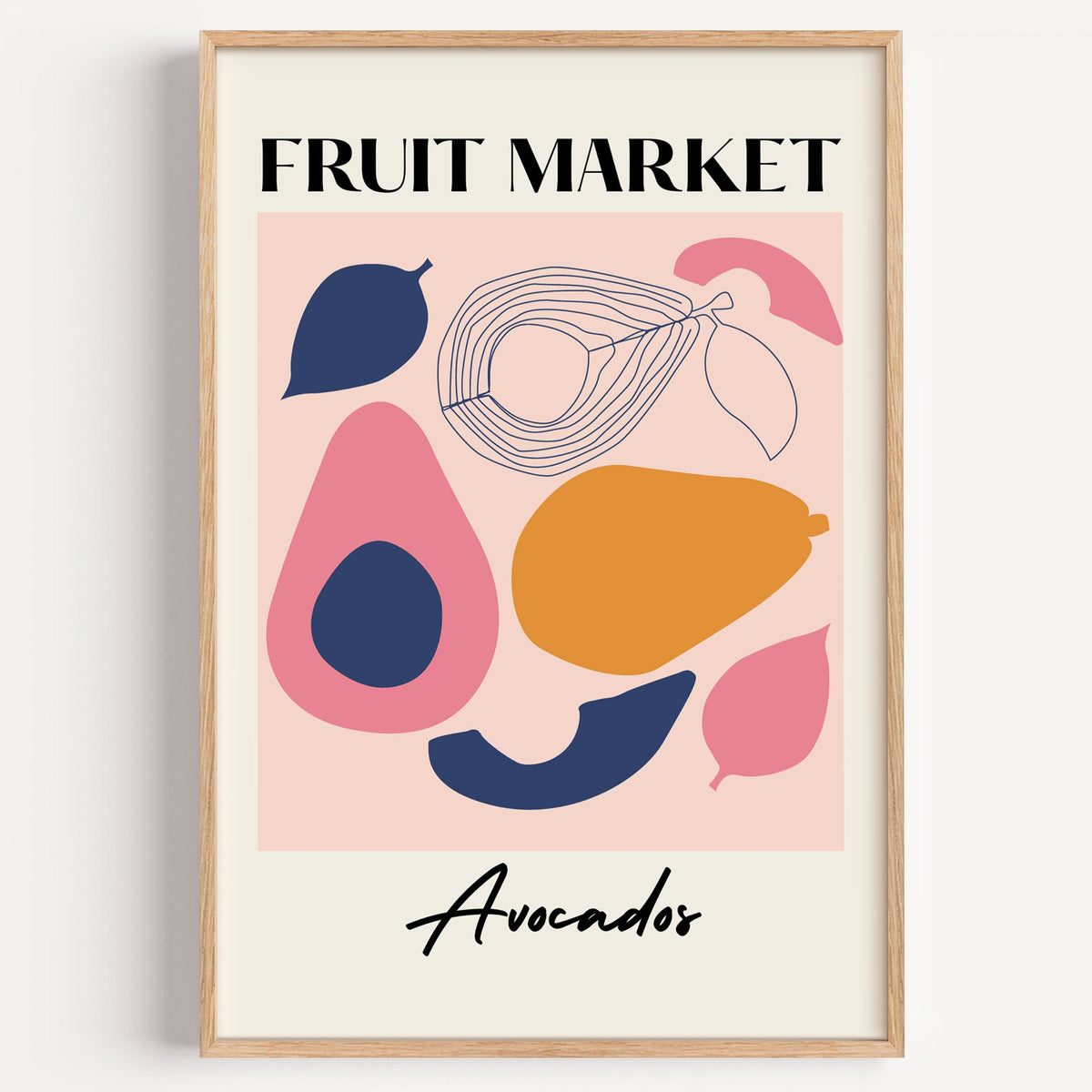 FRUIT MARKET Avocados cut-paper print in a light oak frame on a plain white wall