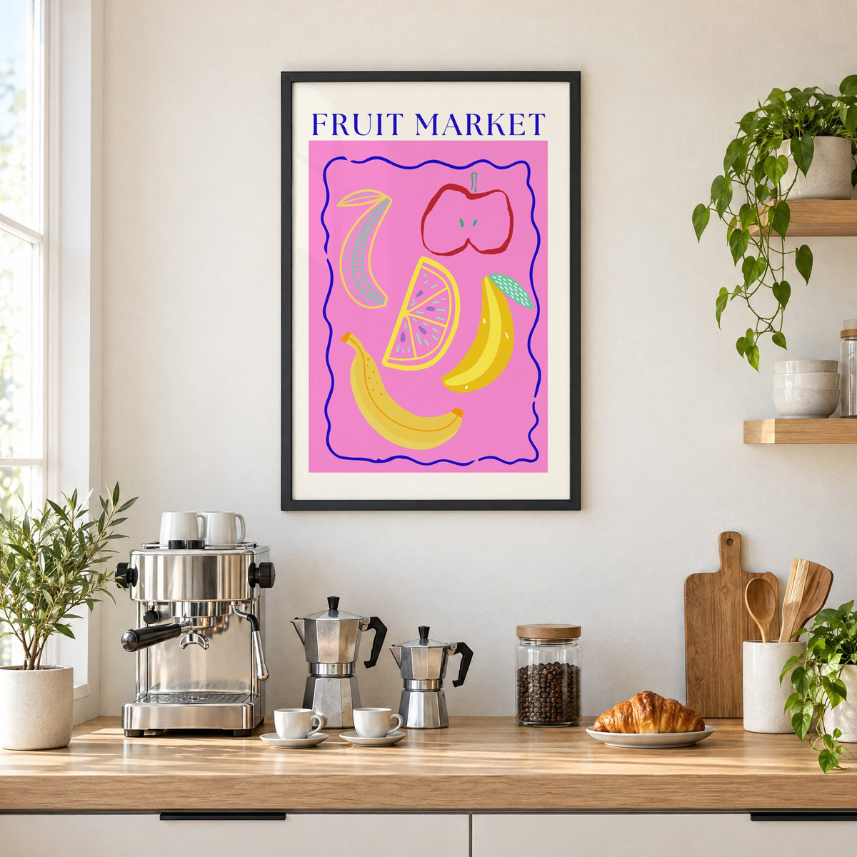 FRUIT MARKET bananas, apple and citrus print in a black frame above a home espresso bar with moka pots and espresso cups