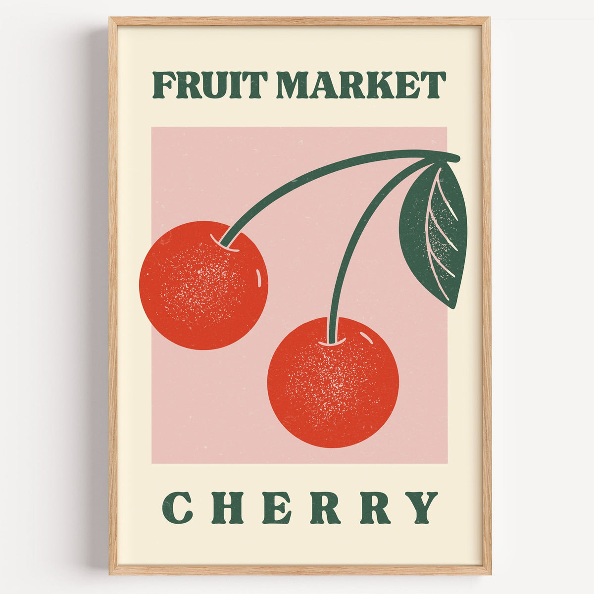 Fruit Market cherry print in a light oak frame on a plain white wall