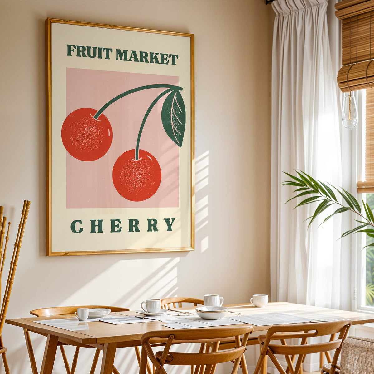 Fruit Market cherry print shown in a gold frame above a breakfast table by a curtained window