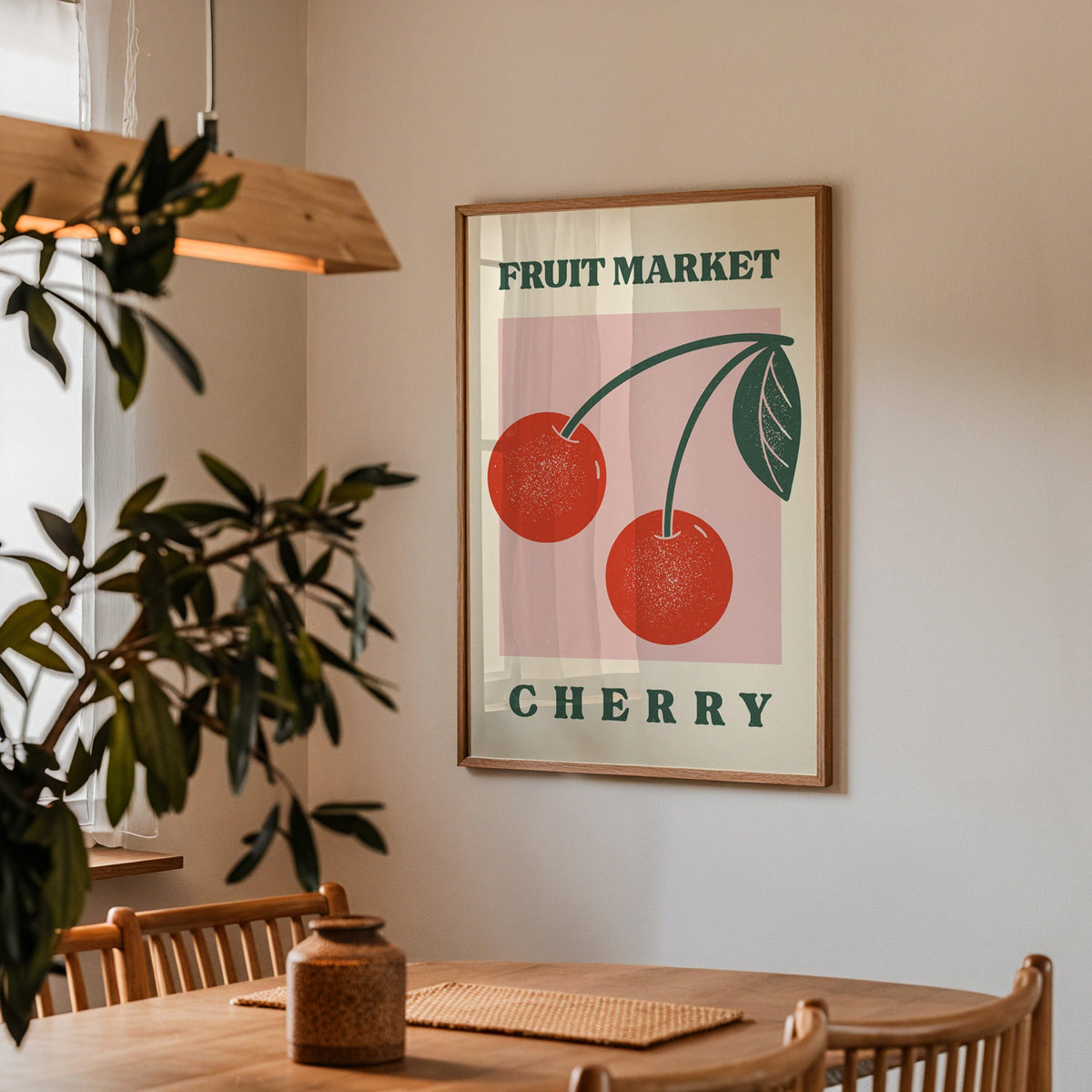 Fruit Market cherry print in a walnut frame above a dining table with olive branches
